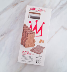 Boxed Silikomart Professional product with red logo, showing bear-shaped silicone molds and chocolate bear figures on the front.