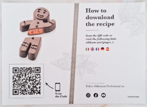 Promotional flyer featuring a chocolate-smiley mold and a QR code to scan for the recipe access.
