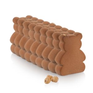 Close-up of a long, curved stack of brown fuzzy spheres with a soft, velvety texture.